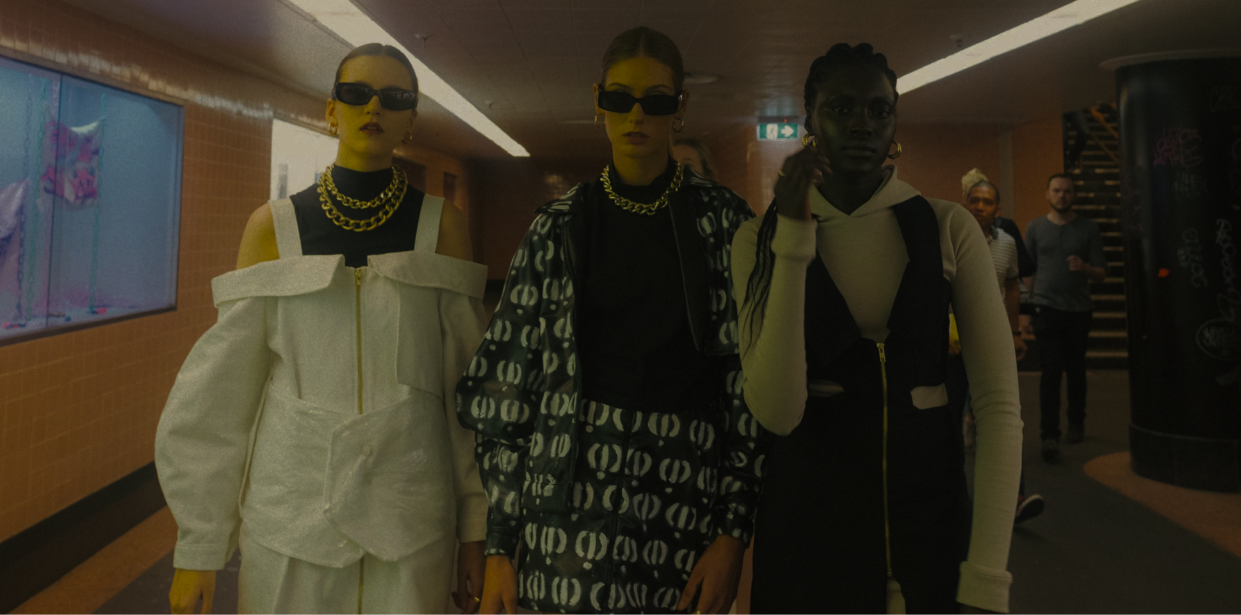 Three women walking in the subway